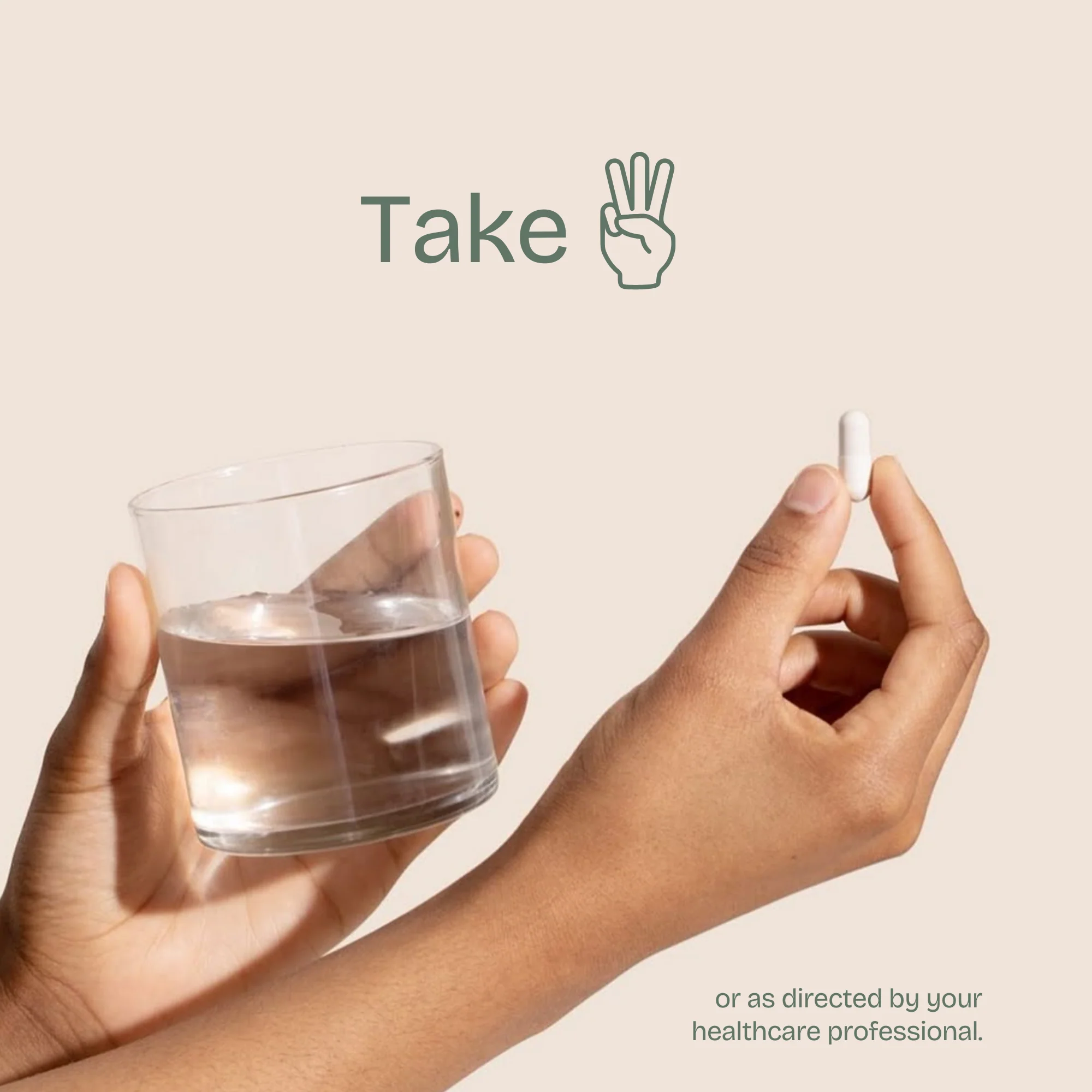 One hand holding a glass of water and the other holding a white capsule, with the words “Take 3”