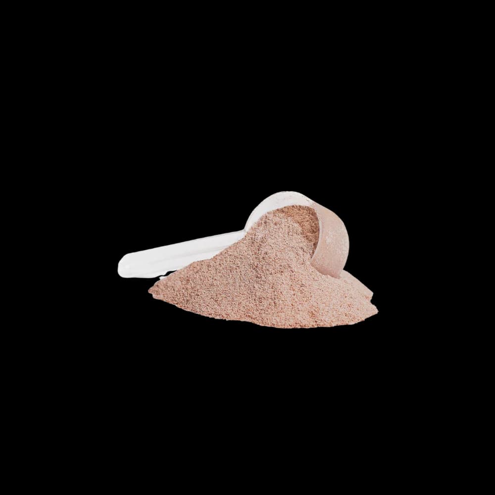Scoop of Brazen chocolate collagen powder spilling onto a white surface